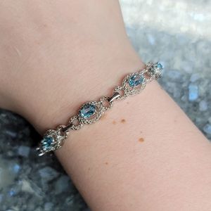 Sterling silver and blue topaz tennis bracelet